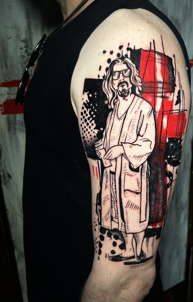 Tatuaggio trash polka di Lenny Fastidio, il Drugo del Grande Lebowski sul braccio